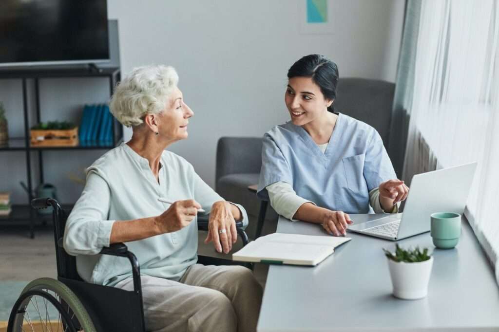 Trusted NDIS Provider in Logan 12 young nurse assisting senior woman